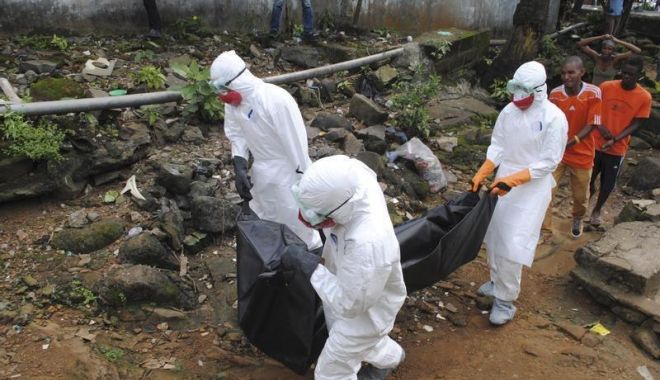 O BOALĂ TERIBILĂ S-A REÎNTORS ȘI FACE VICTIME! - 2014westafricaebola-1525856672.jpg