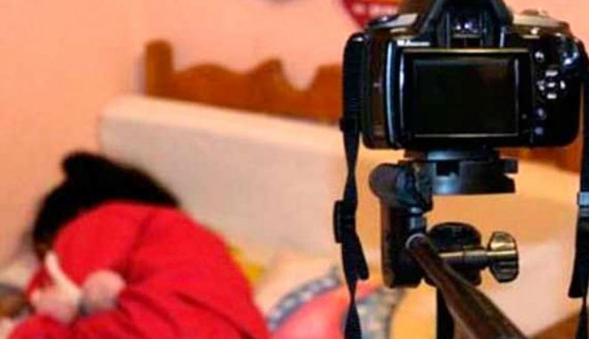 Percheziții pentru destructurarea unei grupări specializate în pornografie infantilă, amenințare și șantaj - 3622-1495443493.jpg