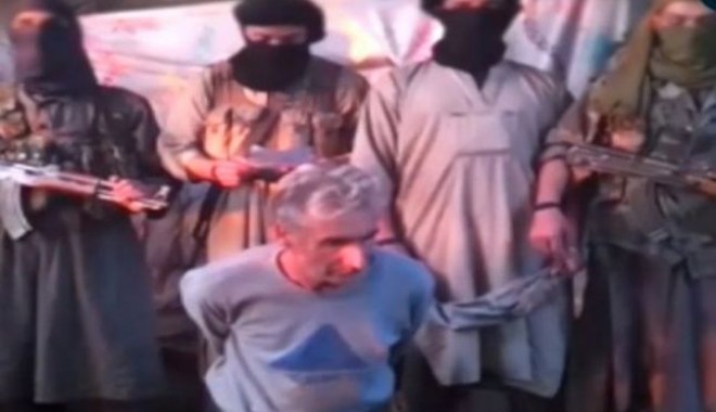 Franța a coborât în bernă drapelele după executarea ostaticului francez - 646x404-1411649783.jpg