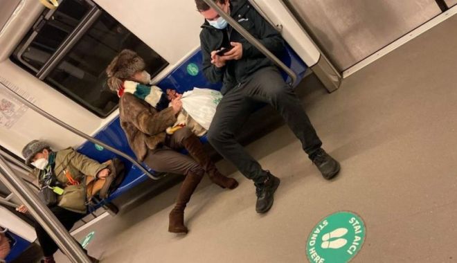 Femeia care a încercat să împingă oamenii pe șinele de la metrou cu o cruce de lemn, a fost prinsă - agresor-1642601110.jpg