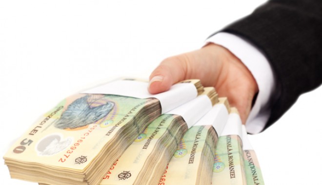 Statul limitează despăgubirile pentru case naționalizate la 15% din valoarea imobilelor. Suma va putea fi plătită pe o perioadă de 10-12 ani - banileibancnoteshutterstock-1334144142.jpg