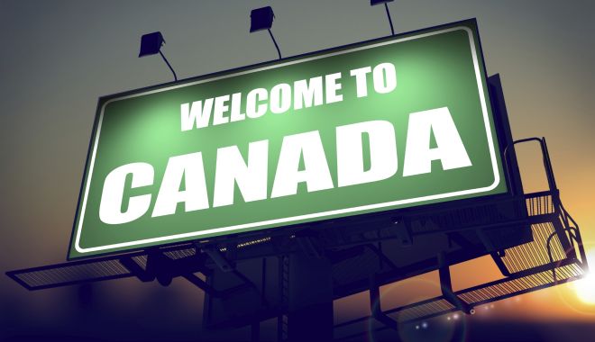 Dispută la vârf, în Canada, pe tema vizelor pentru români. Trudeau, chemat să dea explicații - canadabillboard-1529048460.jpg