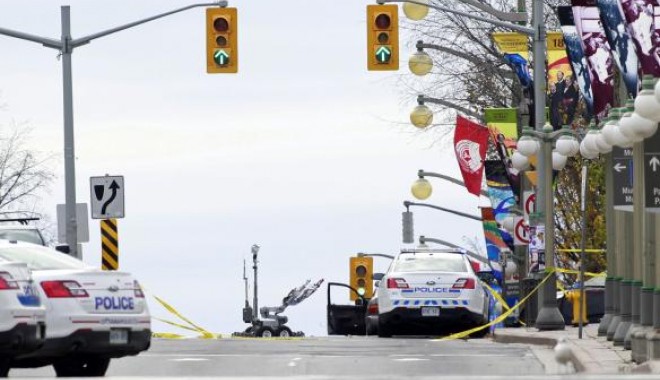 Incidente armate în Ottawa. Unul dintre autori este militant islamist / Galerie foto - download2-1414047012.jpg