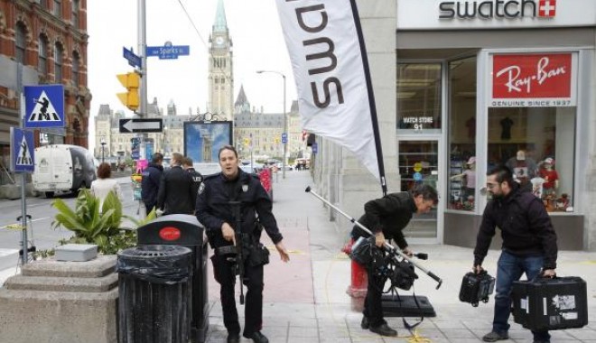 Incidente armate în Ottawa. Unul dintre autori este militant islamist / Galerie foto - download7-1414047049.jpg