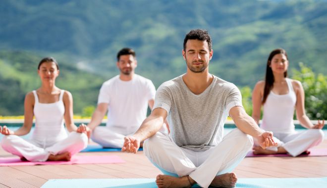 Astăzi este sărbătorită Ziua internaţională Yoga - groupofpeoplemeditatinginayogacl-1624258882.jpg
