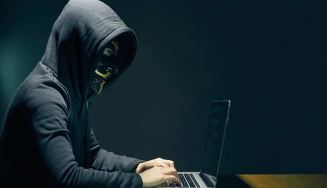 Bărbat cercetat după ce a spart sistemul informatic al unei bănci și a sustras peste 180.000 de euro - hackergu577f9e9d3df78c1e1fb0b9c4-1529669313.jpg