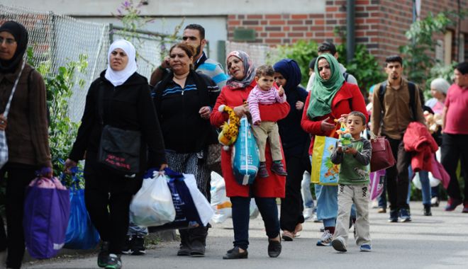 Lege ce restrânge reîntregirea familială pentru refugiați, adoptată de deputații germani - lege-1517498052.jpg