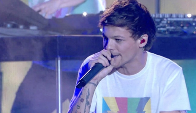 Un membru al trupei One Direction a fost arestat - louistomlinsonxfactorperformance-1488705845.jpg