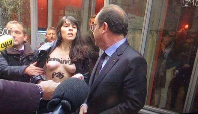 Francois Hollande, abordat de două activiste Femen topless, la Paris / VIDEO - pho78a43be45e9711e48b751332e2e70-1414515711.jpg