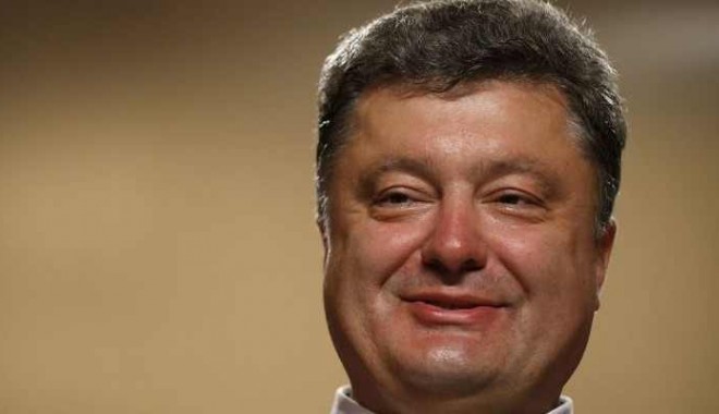Doliu național în Ucraina după doborârea avionului militar - porosenco-1402762119.jpg