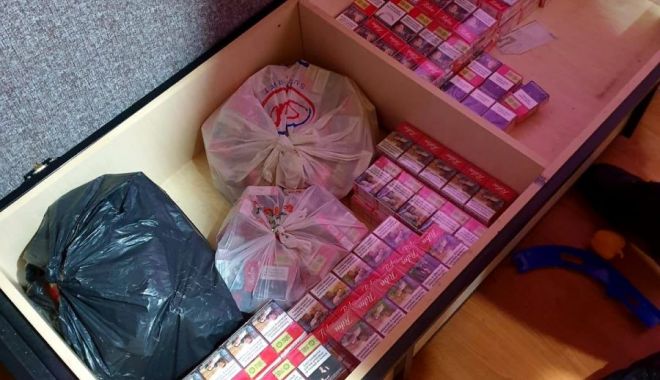 Două persoane reţinute şi 35.000 de pachete de ţigări confiscate în urma a 20 de percheziţii