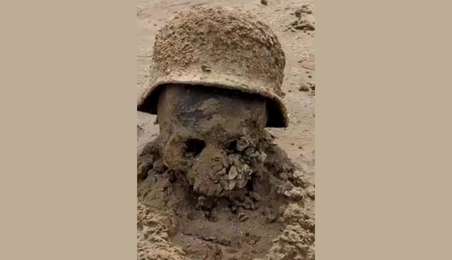 Imagini apocaliptice au ieșit la suprafață după explozia barajului din Ucraina. Rămășițele a zeci de soldați au ieșit din morminte