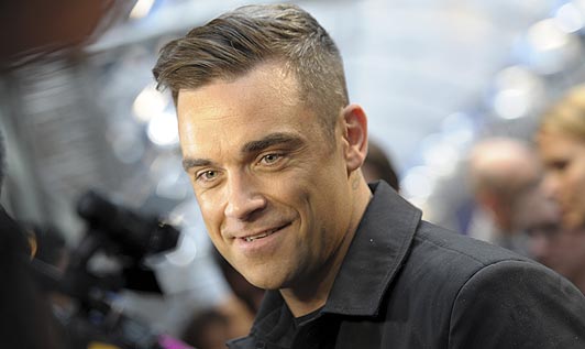 Robbie Williams a ajuns în România - robbiewilliamsma1458533a-1437062021.jpg