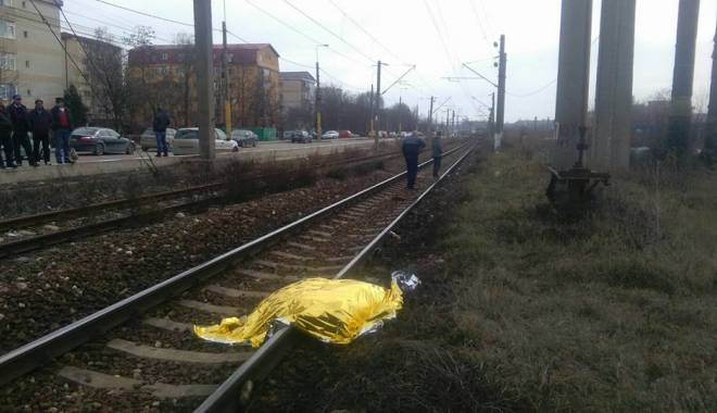 TRAGEDIE FEROVIARĂ LA CONSTANȚA. UN BĂRBAT A FOST TĂIAT DE TREN. O femeie din zonă nu l-a ajutat pentru că avea mâncarea pe foc - tren-1455796051.jpg