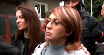 Stire din Eveniment : Fiica milionarului ucis în atentatul cu bombă de la Arad adusă sub escortă la București