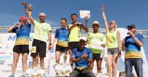 Stire din Sport : Basarabenii Igor Ţimbalist şi Diana Sinic, marii câştigători ai Maratonului Nisipului