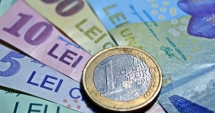 Stire din Economie : Leul câștigă la dolar și francul elvețian, dar pierde la euro
