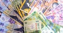Stire din Economie : Leul pierde la euro și dolar, dar câștigă la francul elvețian