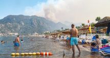 Stire din Actualitate : Mii de turişti s-au refugiat pe malul Mării Egee ca să scape de incendii