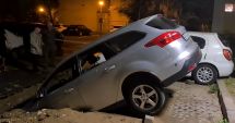 Stire din Eveniment : O mașină s-a prăbușit într-o groapă, după ce o bucată din parcare s-a surpat brusc