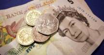 Stire din Economie : Lira sterlină înregistreză un minim istoric față de dolar și euro