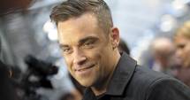 Stire din Monden : Robbie Williams a ajuns în România