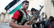 Stire din Actualitate : Rebelii din Siria ocupă poziții cheie împotriva jihadiștilor