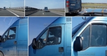 Stire din Eveniment : INCONȘTIENȚĂ PE AUTOSTRADĂ. Șoferul unui microbuz, filmat cu picioarele pe volan
