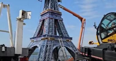 Stire din Actualitate : O copie a Turnului Eiffel, realizată din 1,3 tone de deșeuri, a devenit simbolul schimbărilor climatice la JO 2024