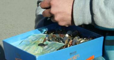 Stire din Economie : Rata unui credit în franci elvețieni, achitată cu șapte kilograme de monede