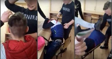 VIDEO / Imagini șocante! Un elev e bătut crunt cu pumnii și picioarele, scuipat și umilit de mai mulți colegi