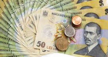 Stire din Economie : Leul pierde la dolar, dar recuperează la euro