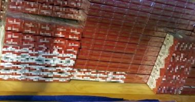 Stire din Eveniment : Percheziții domiciliare într-un dosar de contrabandă cu țigări. Un bărbat a fost reținut