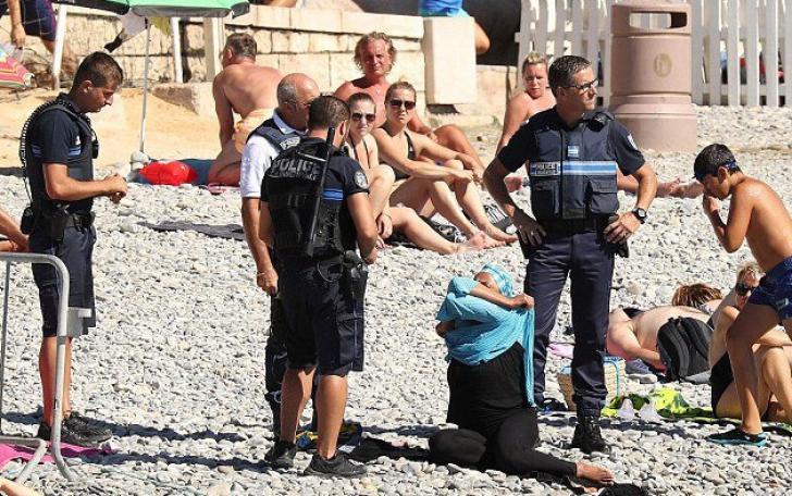 FOTO / Polițiștii francezi au obligat o femeie musulmană să se dezbrace de burkini - 57bd384b682ccf99a47972d8-1472046848.jpg