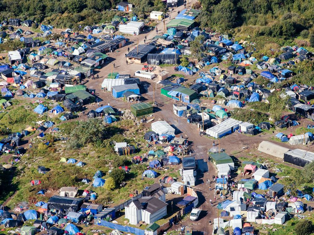 Justiția din Franța a aprobat închiderea taberei de la Calais - calaisafp-1476808276.jpg