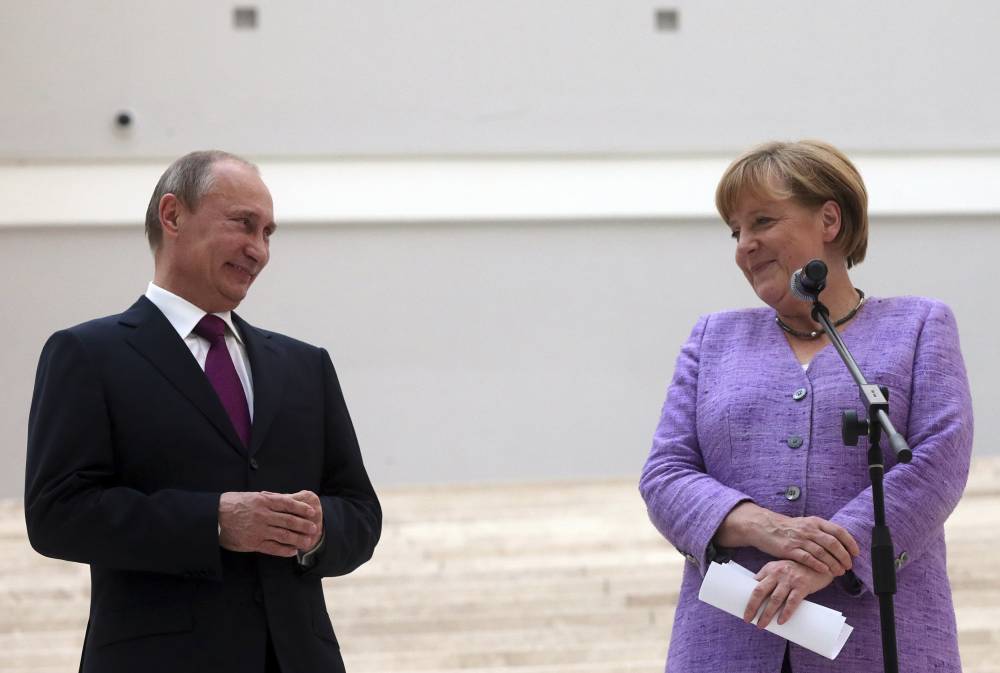 Merkel vrea să discute cu Rusia problema atacurilor informatice și a știrilor false - merkelputin-1487419435.jpg